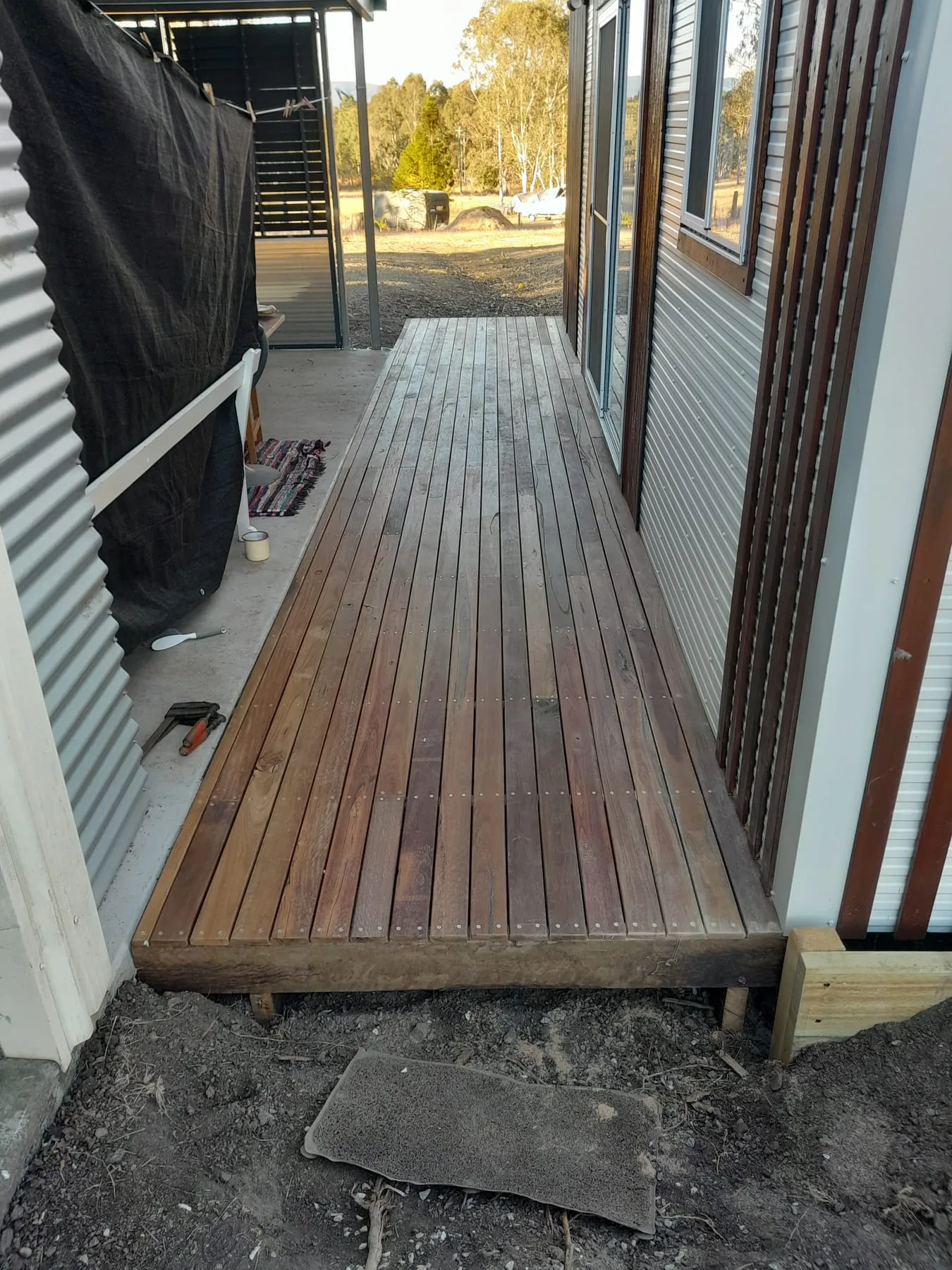 The finished hardwood deck from the end, with a step down