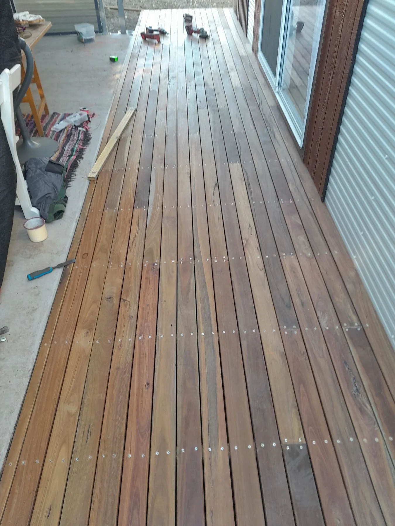 A new hardwood deck along the side of a house