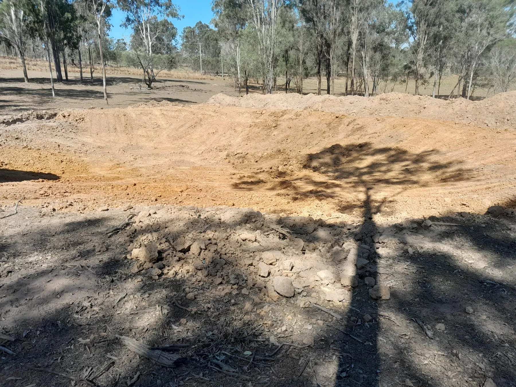 A dam being dug, nearly completed