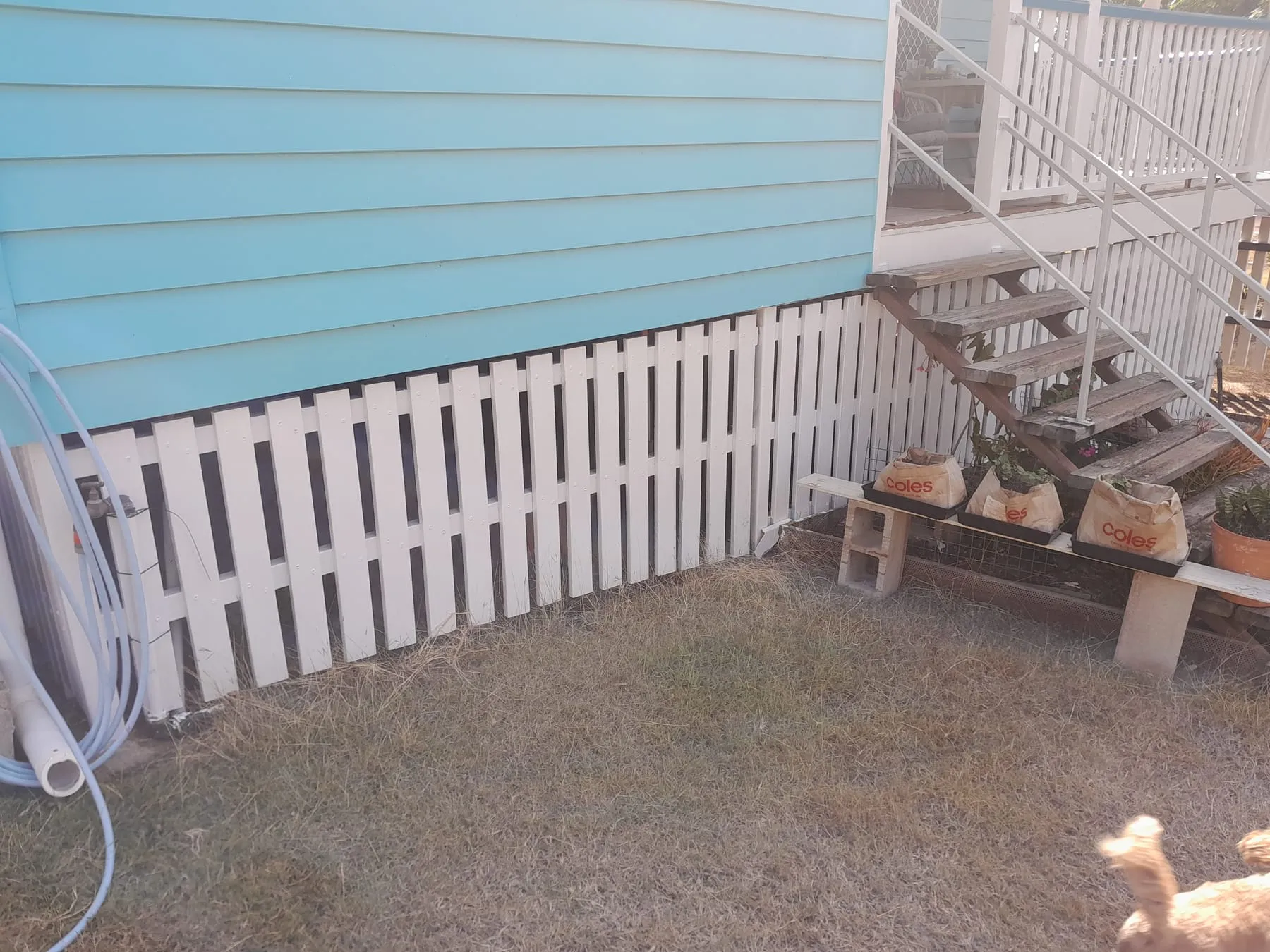 New white lattice skirting fitted under a house